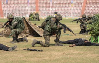 Personnel of the Central Reserve Police Force simulate a counter-terror operation, as they
