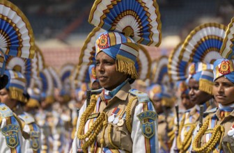 Central Reserve Police Force (CRPF) personnel wearing ceremonial headgear stand in formation during