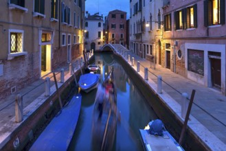 Gondola in the evening in a side canal in the Dorsoduro district, Venice, Veneto, Italy