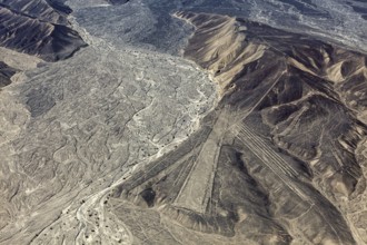 Desert mountain landscape with impressive Nazca lines from above in Peru, the geoglyphs and images