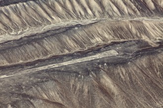 View of the mysterious Nazca Lines in Peru from above on sandy hills, the geoglyphs and paintings