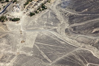 Aerial view of a dry desert landscape with the famous Nazca lines in Peru, the geoglyphs and images