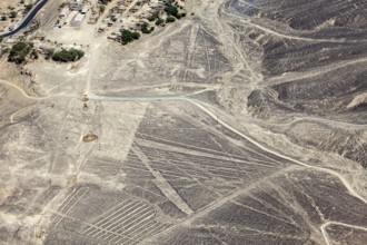 Desert landscape with visible Nazca lines seen from above in Peru, The geoglyphs and images in the