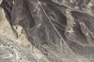 Detailed view of the Nazca lines running through the sandy landscape, the geoglyphs and paintings