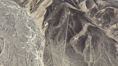 Desert landscape with visible line formations and elevations, the geoglyphs and images in the