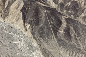 A mountainous country with a recognizable line pattern flying over the desert, the geoglyphs and