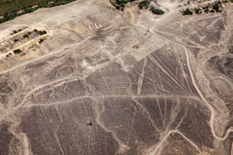 Aerial view of Nazca lines in the desert with clearly visible geoglyphs, the geoglyphs and images