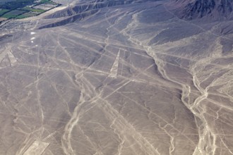 Aerial view of Nazca lines in a dry desert landscape with distinctive geoglyphs, the geoglyphs and