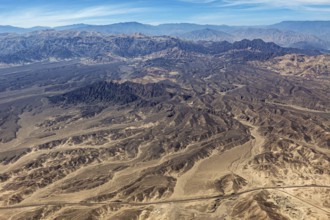 Barren mountainous desert area with characteristic hills, taken from above, The desert landscape