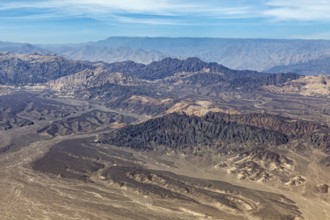 Hilly mountain landscape in a barren desert from a bird's eye view, The desert landscape near Nasca