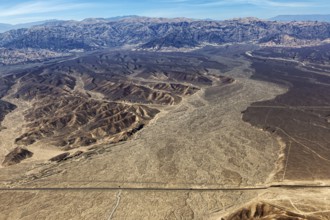 View of vast desert plains and mountain ranges from the air, The desert landscape near Nasca in