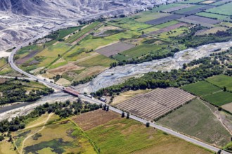 Picturesque green landscape with a river and a wooded road in the valley, The desert landscape near