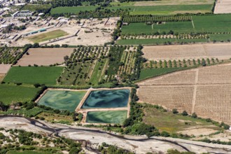 Structured agriculture with green fields and artificial lakes in the landscape, The desert
