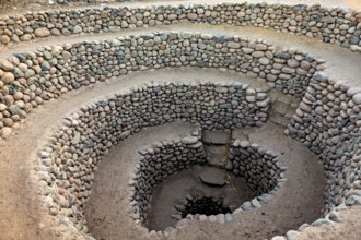 Large spiral of stones spiralling into the ground, The ancient Nazca fountains (Puquios) near