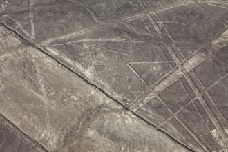 Geometric shapes and lines on a brown desert surface, the geoglyphs and drawings in the desert near