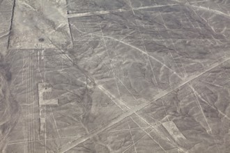 Nazca lines in a vast desert area with geometric patterns seen from the air, The geoglyphs and