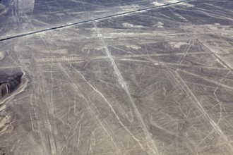 Ancient Nazca lines and patterns on the surface of an extensive desert landscape, the geoglyphs and