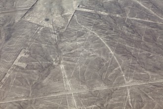 Aerial view of the Nazca lines with visible geometric shapes in the desert, the geoglyphs and