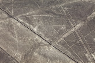 Aerial view of lines and patterns on a dry desert surface, the geoglyphs and drawings in the desert