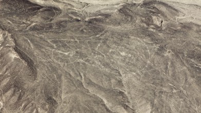 View of a dry desert area with recognizable ancient lines, geoglyphs and images in the desert near