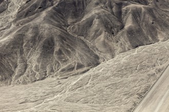 Hilly desert area with interlocking patterns and lines, the geoglyphs and drawings in the desert