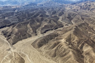 Barren mountain landscape with deep valleys and gentle elevations, the desert landscape near Nasca