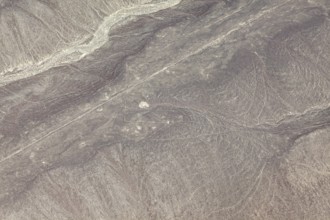 Visible lines and patterns in a barren, dry desert region, the geoglyphs and images in the desert
