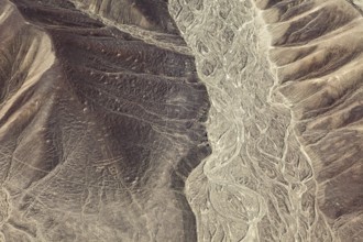 Hilly desert landscape with visible ancient lines from the air, the geoglyphs and paintings in the