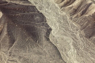 Dry desert hills with clear lines and patterns from the air, the geoglyphs and images in the desert