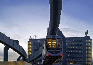 The H Bahn, an automatically controlled large cabin suspension railway in front of the Mathetower