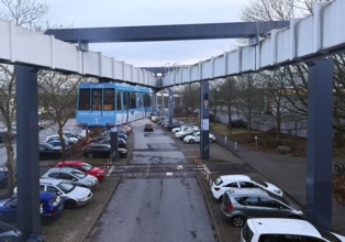 The H Bahn, an automatically controlled large cabin suspension railway above the parking lot of the