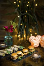Beautifully styled dining presentation featuring vegetable and courgette rolls alongside pulled