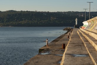 Varna, Bulgaria. September 5th 2020 A man fishing in the Black Sea near the Lighthouse at Varna