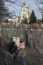 Sofia, Bulgaria, February 6th 2018 Artist painting religious image outside Alexander Nevsky