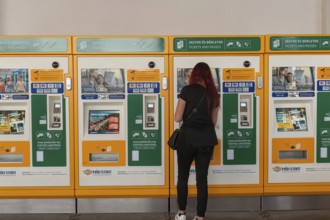Budapest, Hungary. October 1st 2023 A woman buying a train ticket from an automatic machine at
