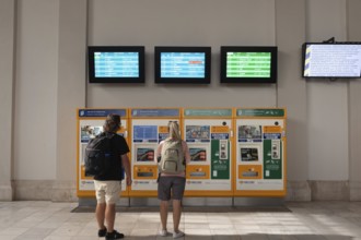 Budapest, Hungary. October 1st 2023 Tourists buying a train tickets from automatic machines at