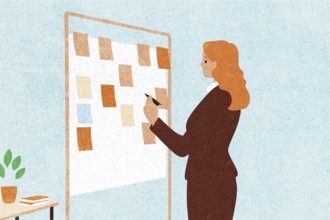 A professional woman stands in front of a message board covered with colorful notes She holds a