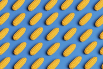 A pattern showcasing plastic corn against a blue background, highlighting the artificiality in