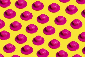 A vibrant pop art-style image featuring pink plastic cupcakes on yellow backgrounds, symbolizing