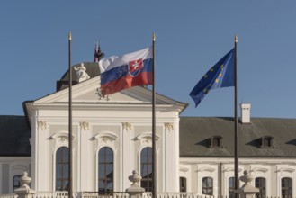 Bratislava, Slovakia. October 3rd 2023 Slovak and EU flags fly outside The Grassalkovich Palace.