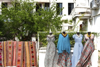 Bodrum, Mugla, Turkey. April 21st 2022 Colourful carpets and pretty dresses for sale on the street