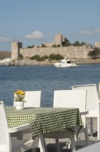 Bodrum, Mugla, Turkey. April 21st 2022 Pretty seaside cafe restaurant tables with table cloths and