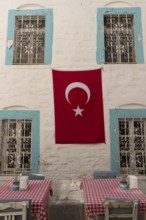 Bodrum, Mugla, Turkey. April 23rd 2022 Pretty cafe tables set against a beautiful pastel blue