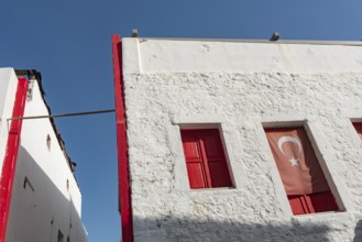 Bodrum, Mugla, Turkey. April 22nd 2022 Graphic architecture and red shuttered windows of