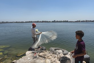 Rosetta, Egypt. June 27th 2024 A local Egyptian fishermen castes his weighted net into the River