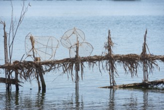 Reed fish traps and metal cages a typical method of fishing along the River Nile at Rosetta in the