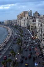 Old high rise buildings overlooking the busy Corniche of Alexandria's Mediterranean Sea front,