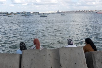 Alexandria, Egypt. December 2nd 2022 Egyptian Muslim Women sit on large concrete blocks designed to