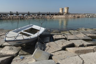 Alexandria, Egypt. December 1st 2022 A boat on concrete blocks positioned as a defence against