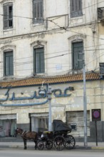 Alexandria, Egypt. December 2nd 2022 Traditional horse and carriage outside an old sea front